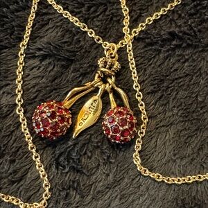 Cherry “Juicy” Couture. 
Red Crystal Cherries with Green enamel leaves Necklace.